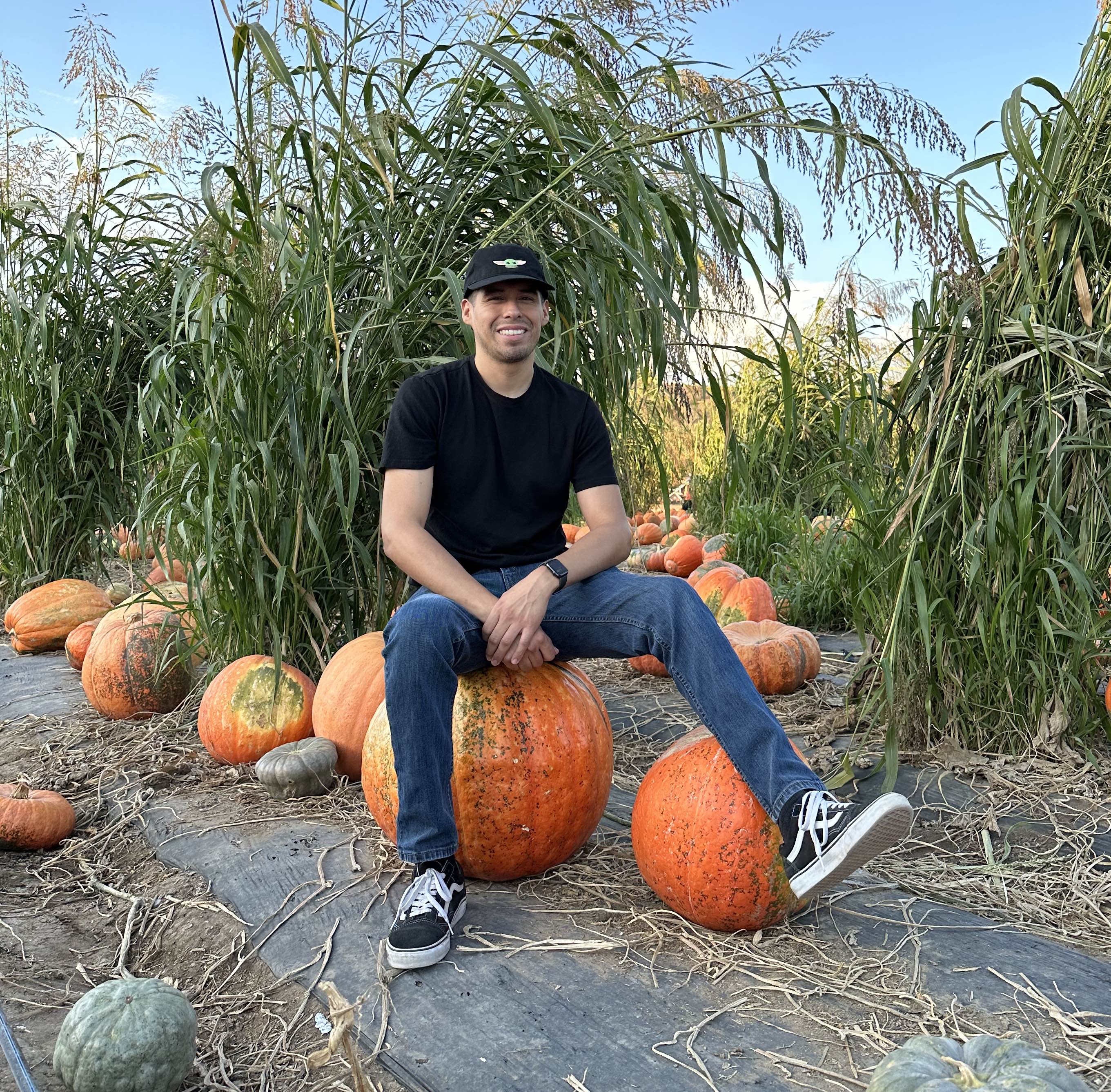 A picture of me sitting on a big pumpkin